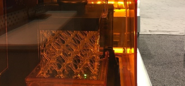 A laser sintering process underway.